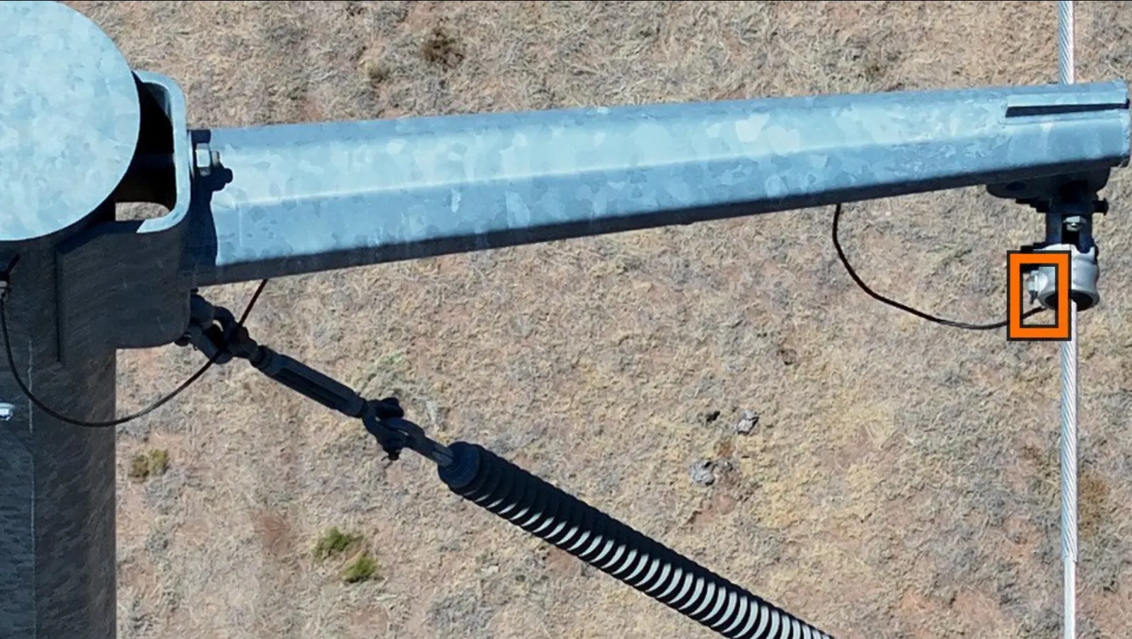 Steel pole hardware with a flagged component